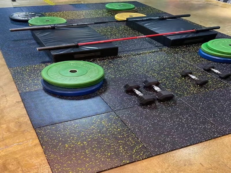 An engineering diagram overlaying a photo of a gym floor, showing force dissipation.